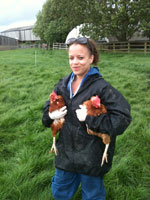 Girl holding chickens