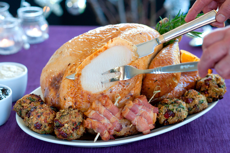 A roast turkey being carved