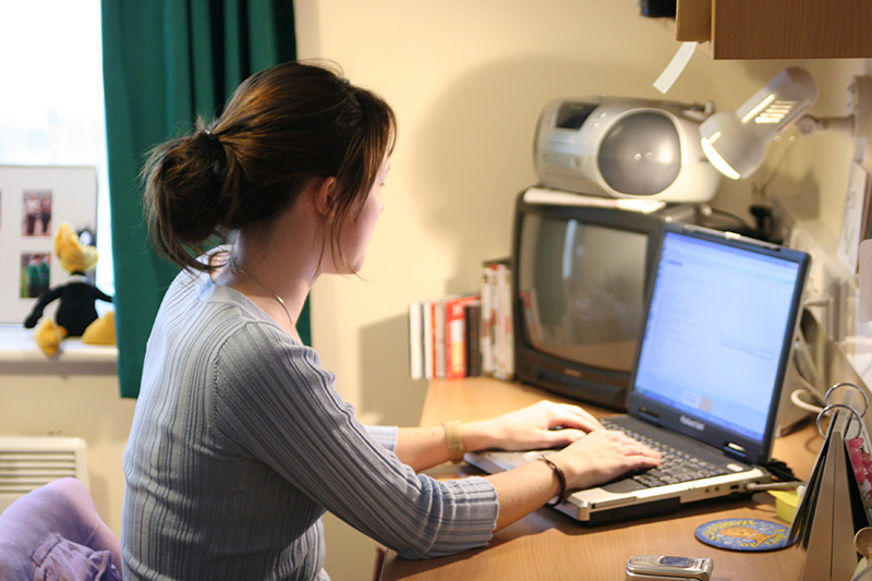 student studying at a laptop