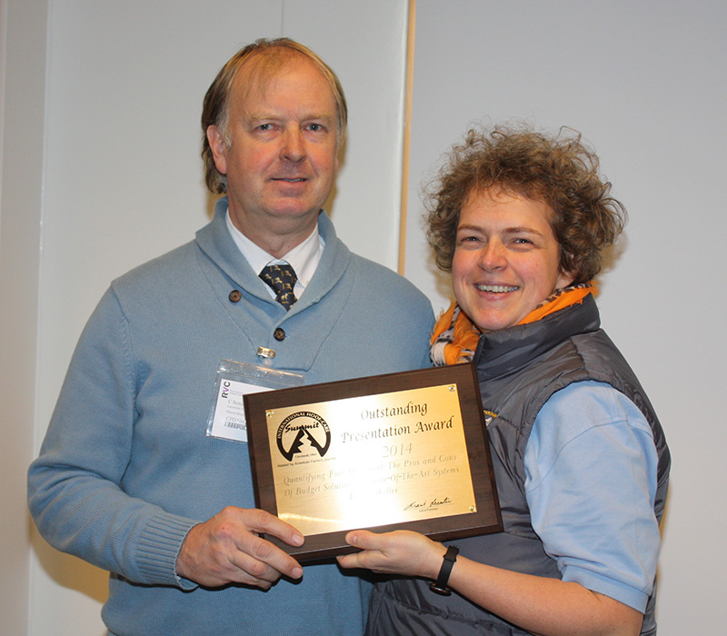 Renate Weller receives her award from Carl Bettison