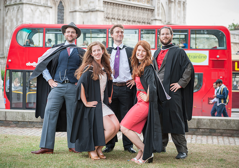 RVC Graduates posing in front of a London bus