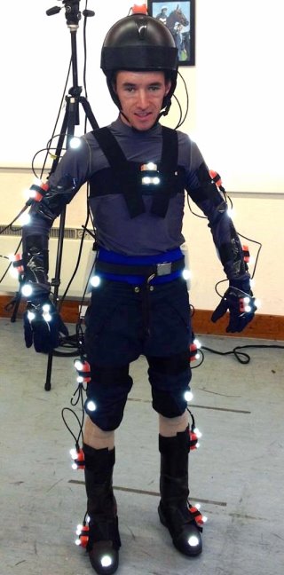 Jockey posing with inertial measurement units attached to various points across his body