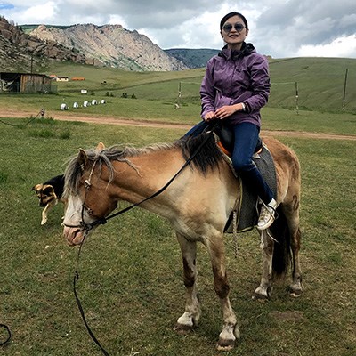 Yu Qiu riding a horse